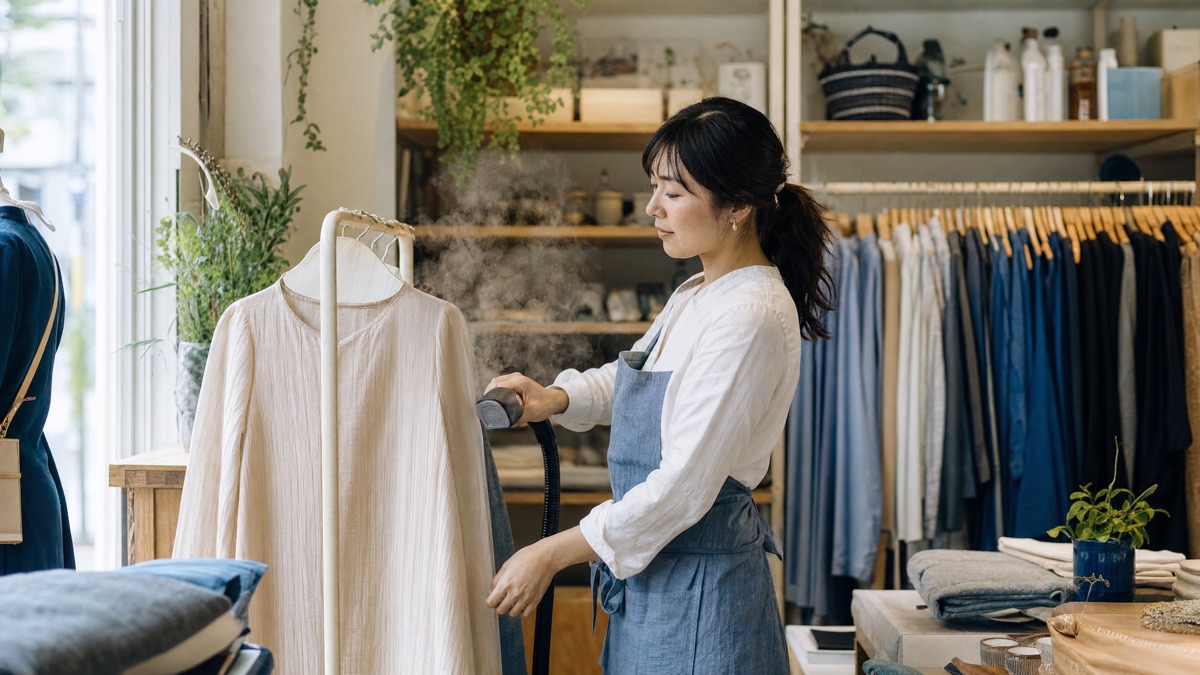 A small business owner working in their shop